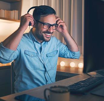 man_on_laptop_and_headphones